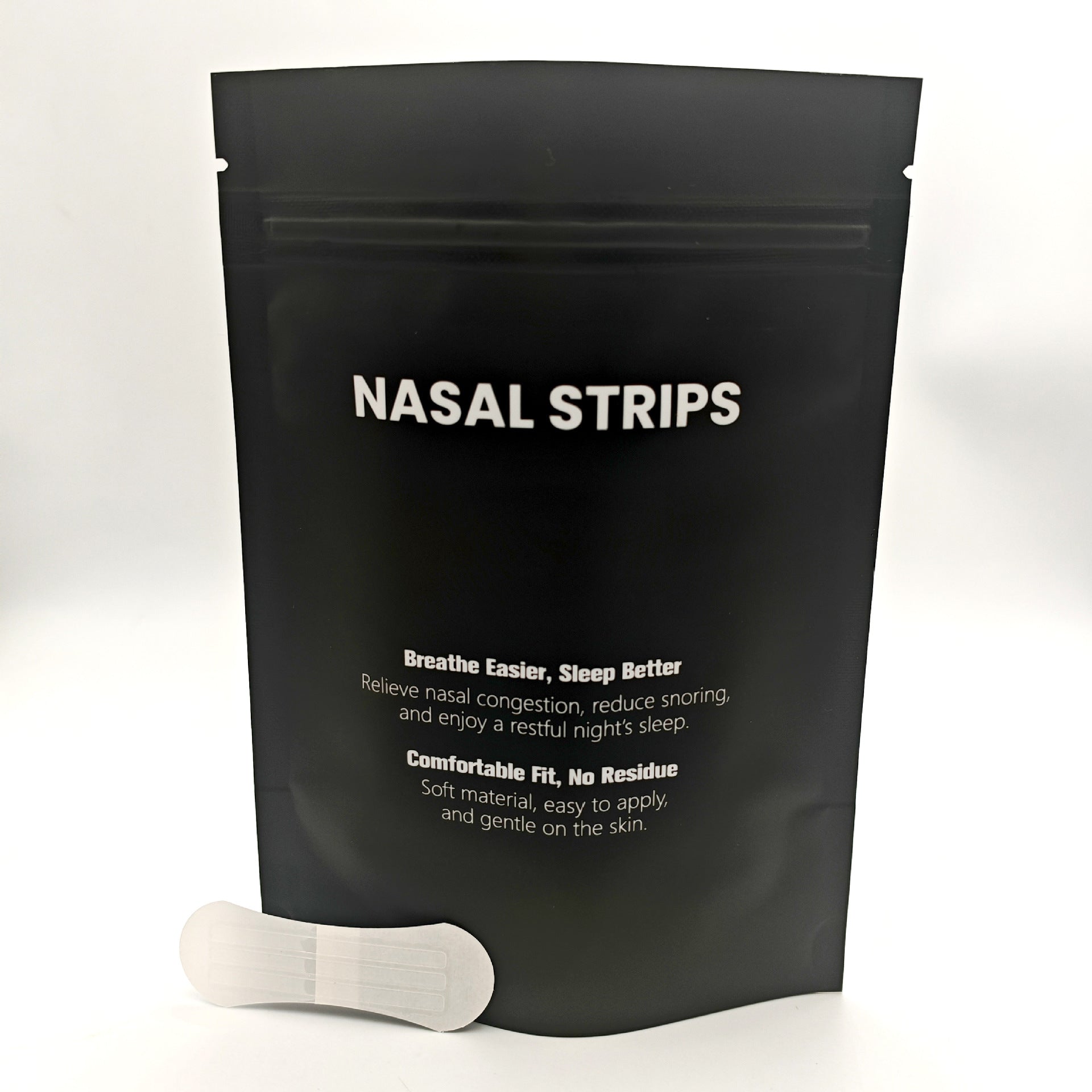 Black package of nasal strips with a white strip on a light gray background