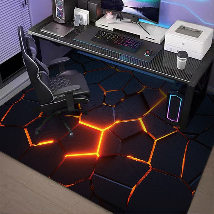 Gaming setup with a desk, chair, and colorful floor design.