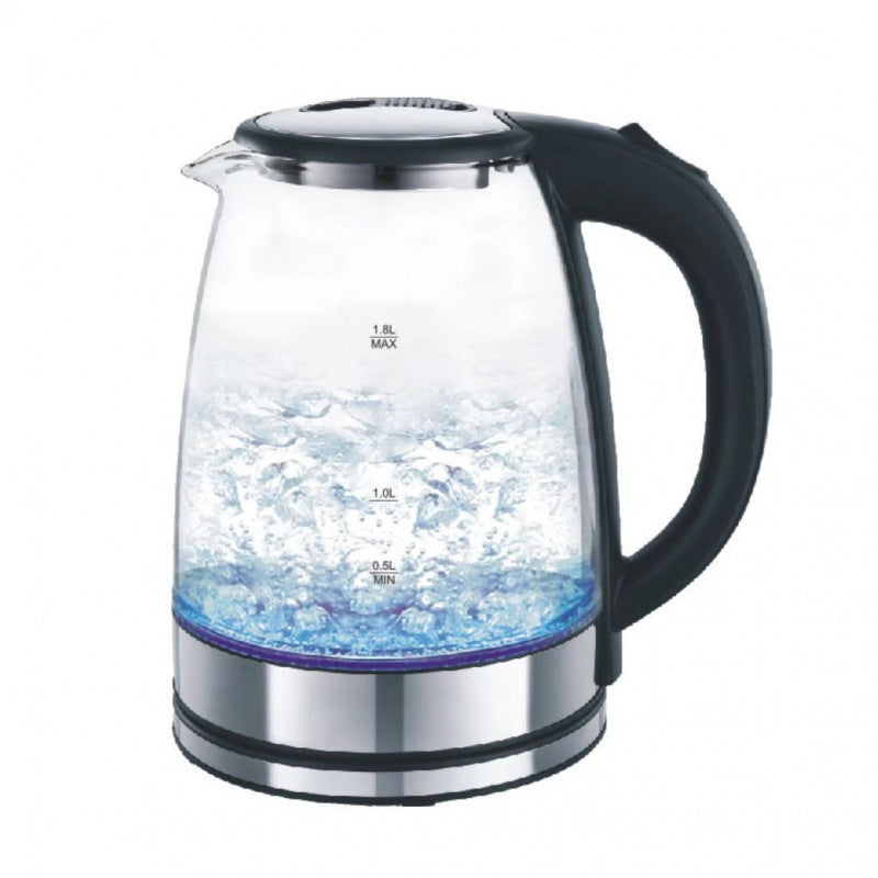 Glass electric kettle with black handle on a white background