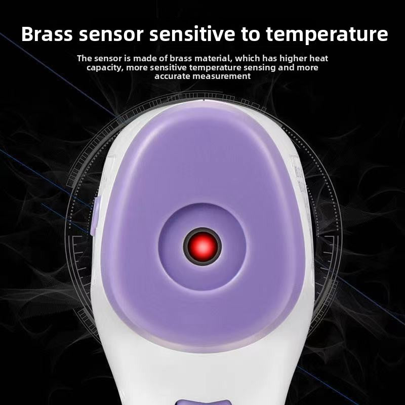 Infrared thermometer with brass sensor on a dark background