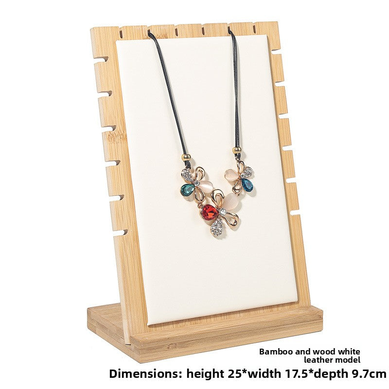 Necklace on a wooden display stand with dimensions text