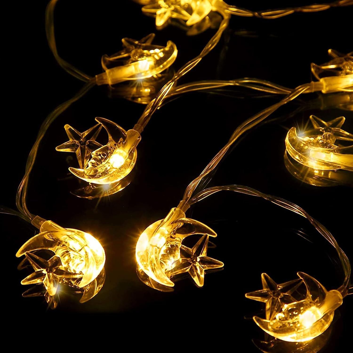 String lights with fish-shaped bulbs on a black background