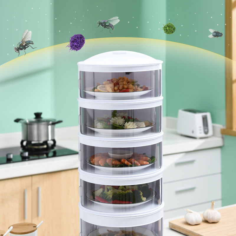 White kitchen storage tower with transparent drawers filled with food on a kitchen counter.