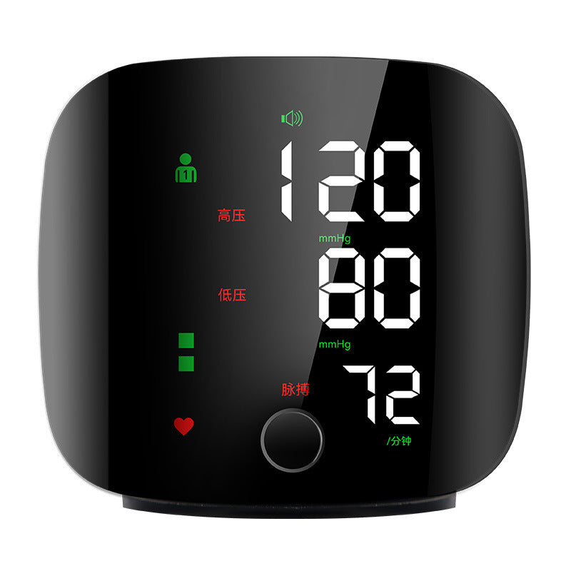 Digital blood pressure monitor with a black casing on a white background