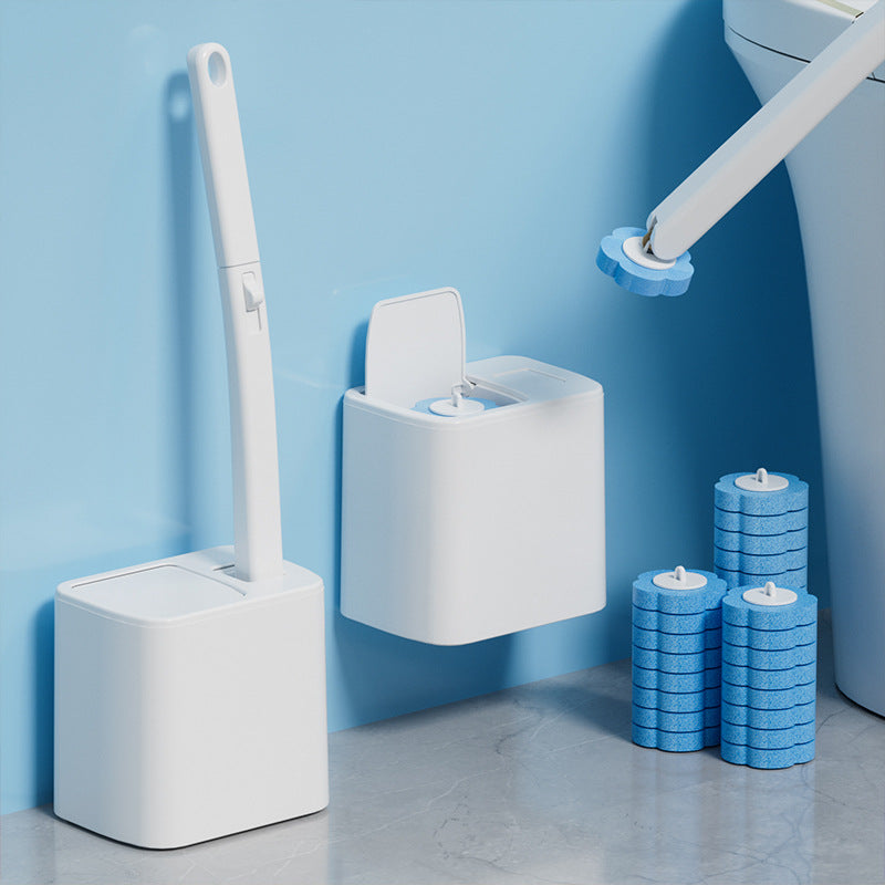 Cleaning brush set with holder and blue cleaning pads on a light blue wall background