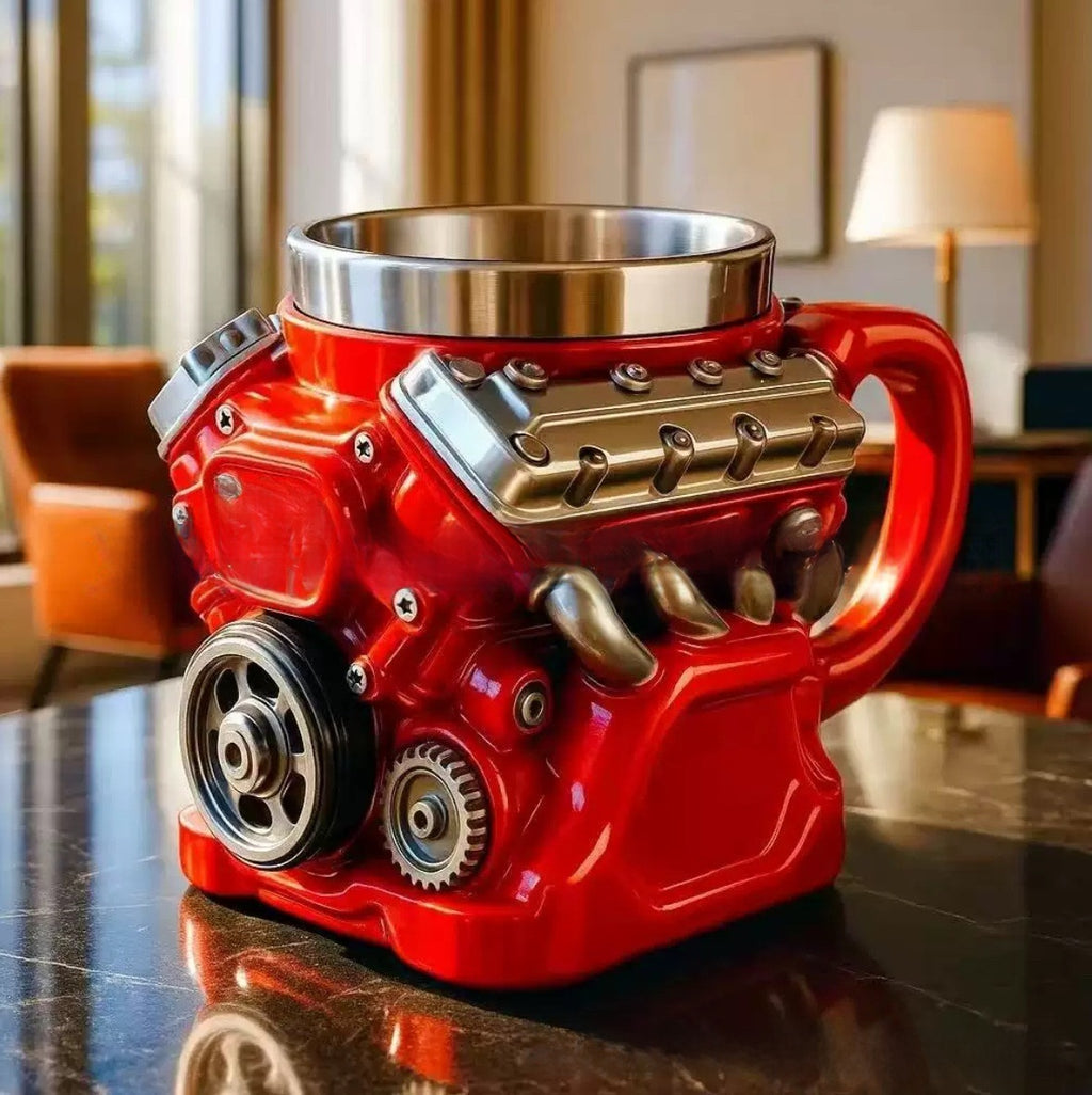 Red engine-shaped mug on a reflective surface with a blurred indoor background