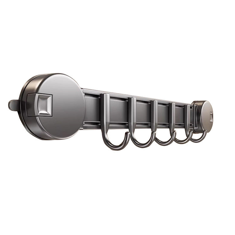 Metallic curtain rod with multiple hooks on a white background