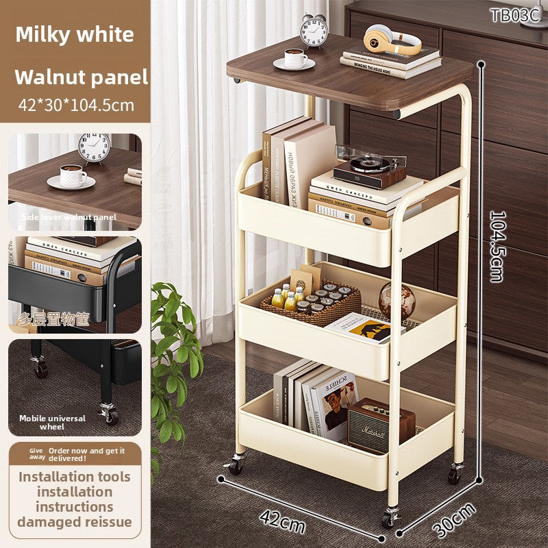 Multi-layered rolling cart with various items on a wooden floor, showing dimensions and features.
