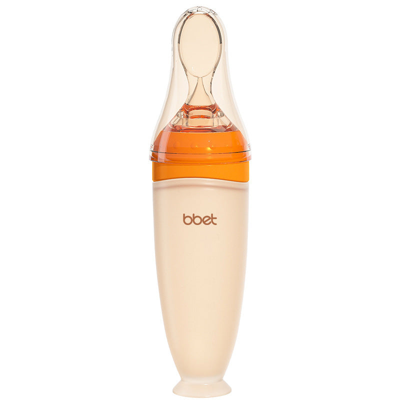 Baby bottle with orange nipple on a white background