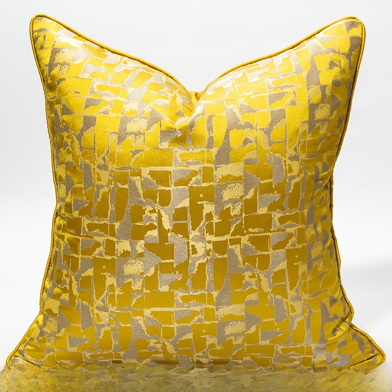 Yellow patterned pillow on a white background