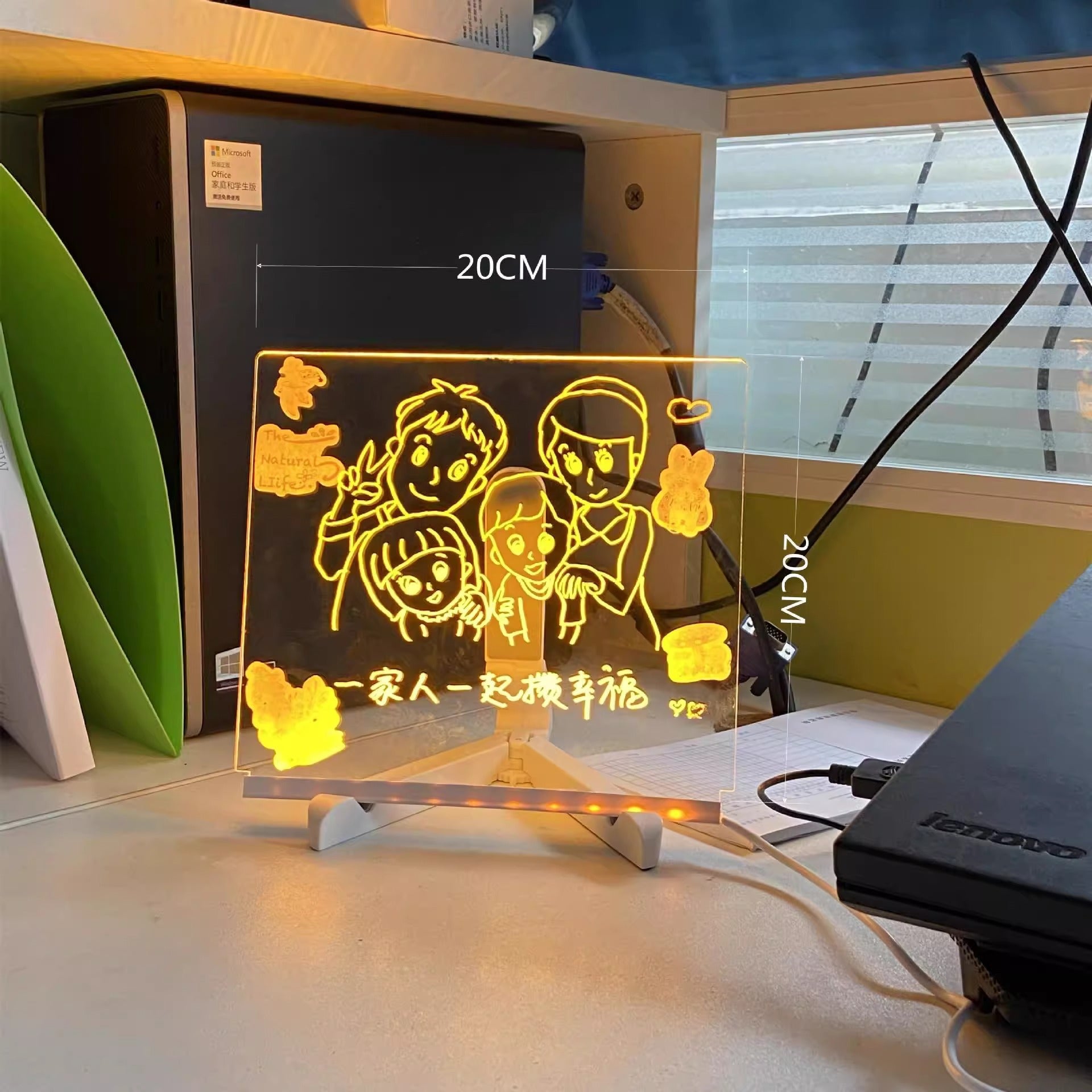 LED light sign with family illustration on a desk