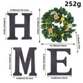 Decorative letters 'H', 'O', 'M', 'E' with a floral wreath and measurements on a white background