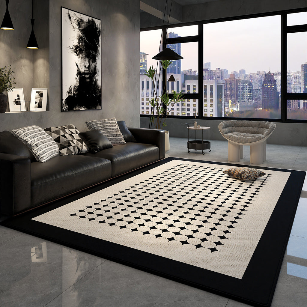 Modern living room with a black and white patterned rug, leather sofa, and cityscape view.