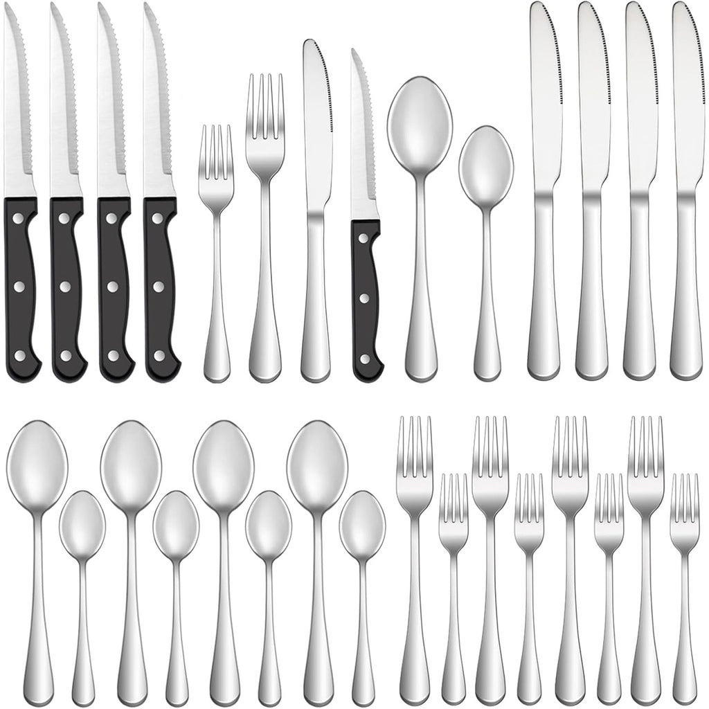 Set of silver cutlery with black handles on a white background