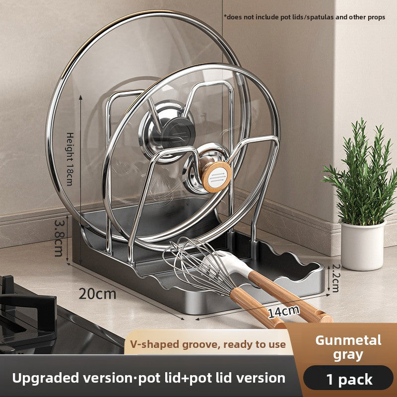 Gunmetal gray pot lid and whisk stand with measurements on a kitchen counter.