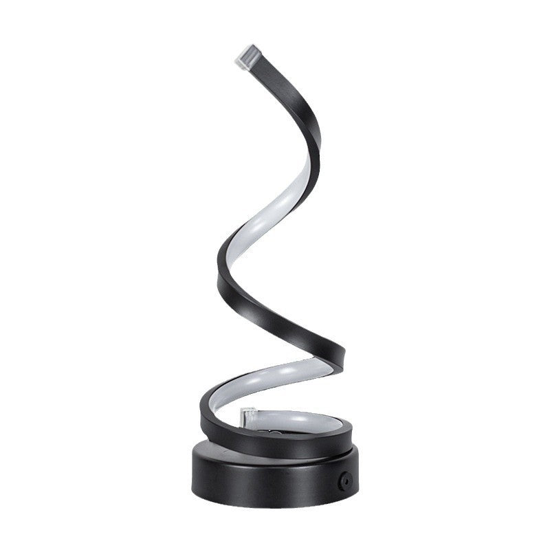 Black spiral LED desk lamp on a white background