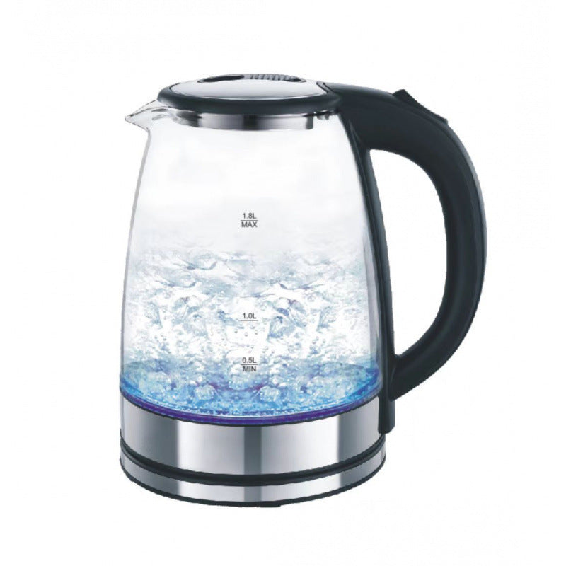 Clear glass electric kettle with black handle on a white background