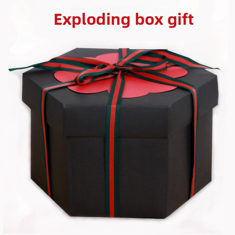 Black gift box with red and green ribbon on a white background, labeled 'Exploding box gift'.