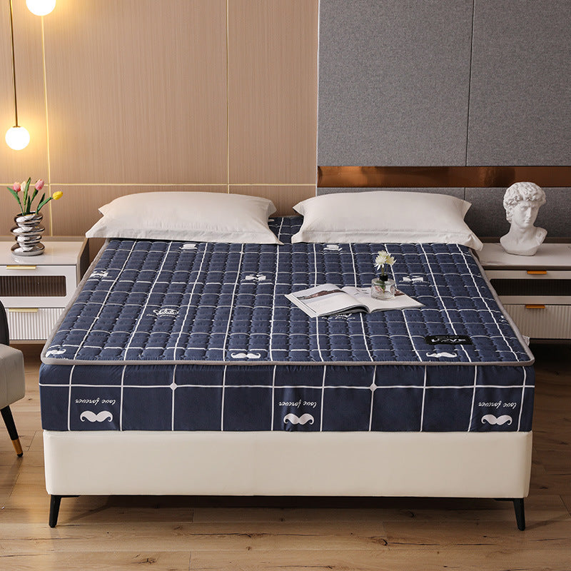 Bed with a blue checkered mattress cover in a bedroom setting.