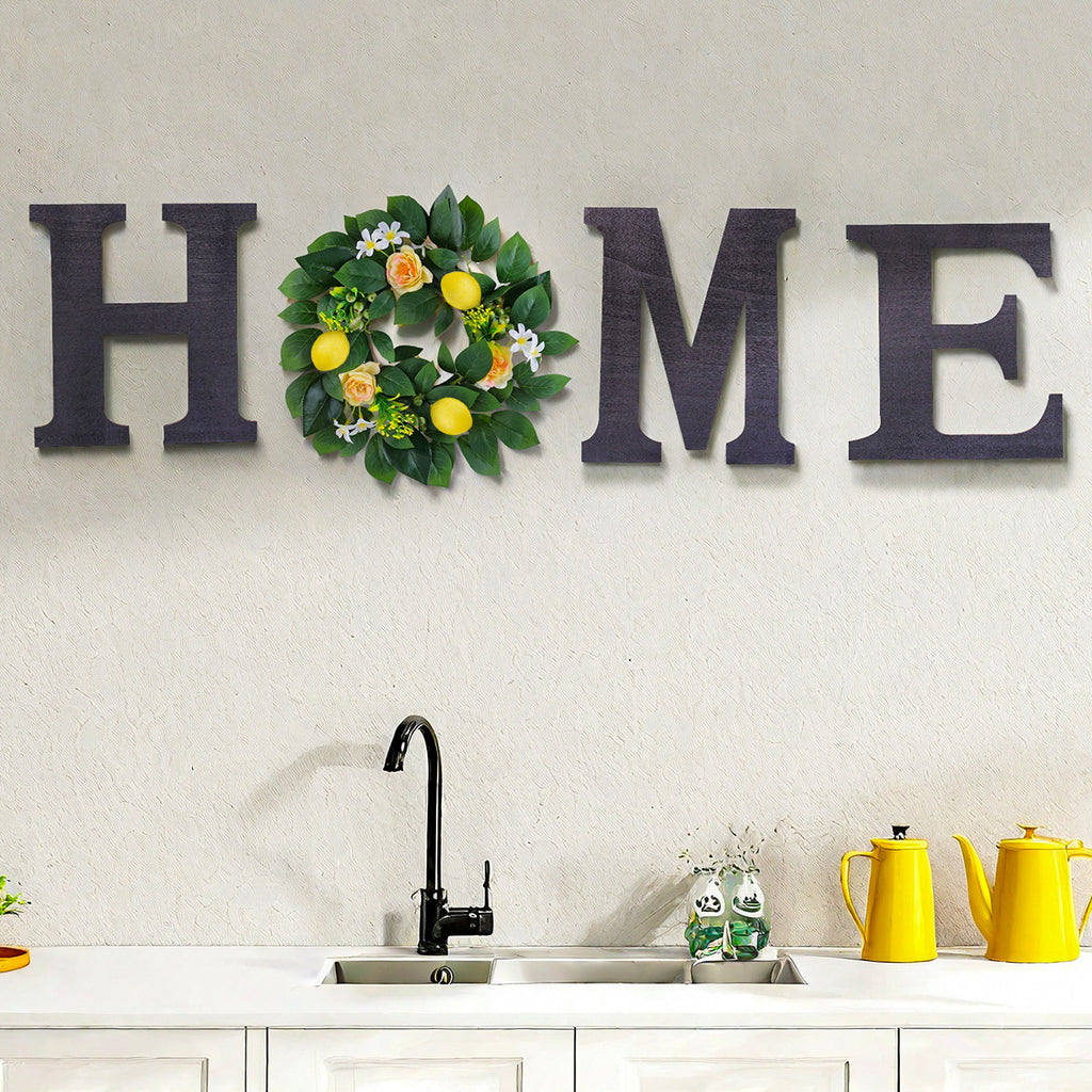 Decorative wall art with 'HOME' letters and a floral wreath above a kitchen sink.