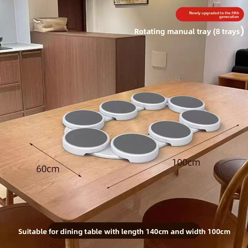 Rotating manual tray with eight trays on a dining table, showing dimensions and compatibility with a table.