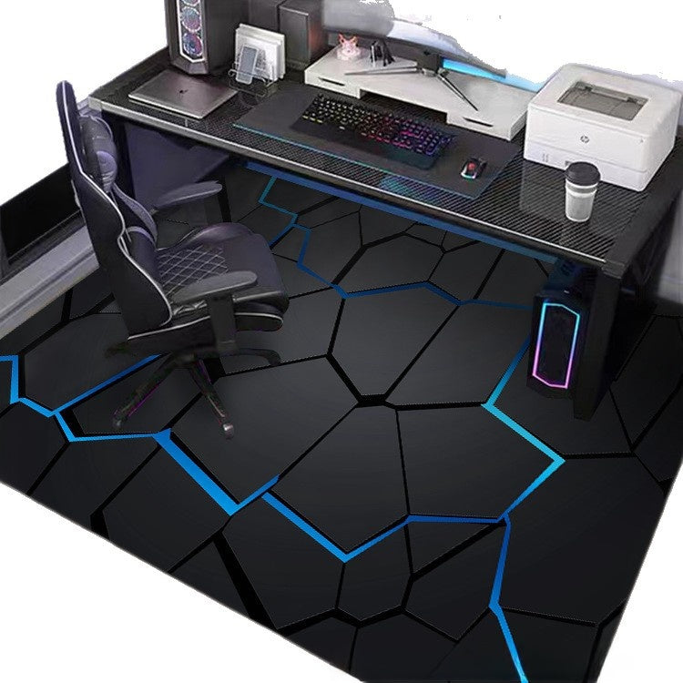 Modern gaming desk with chair, computer setup, and decorative floor.