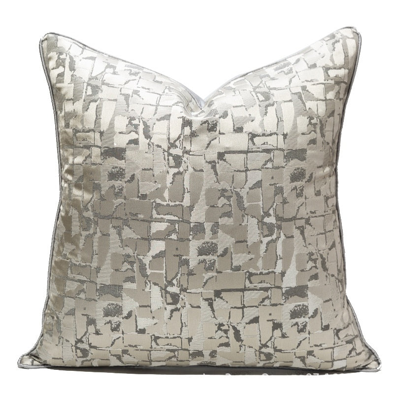 Decorative pillow with a patterned design on a white background