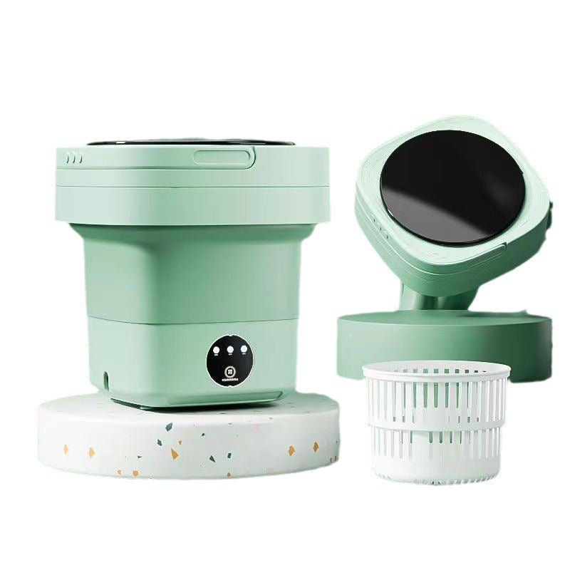 Green portable kitchen appliance with detachable parts on a white background