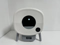 White electronic litter box on a white background