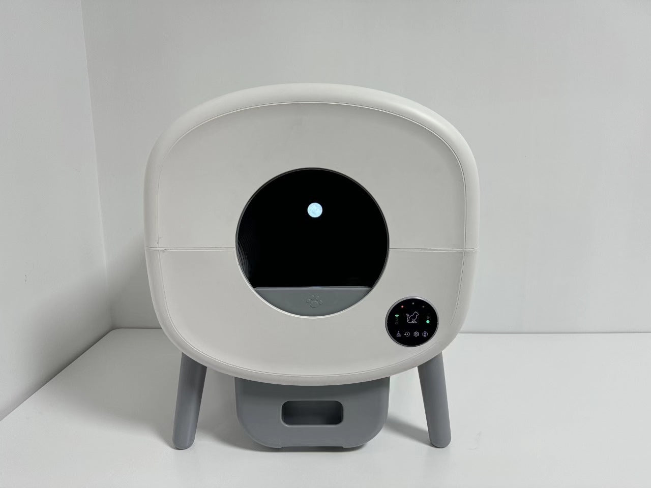 White electronic litter box on a white background