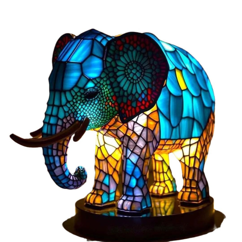 Colorful elephant-shaped lamp with stained glass design on a white background