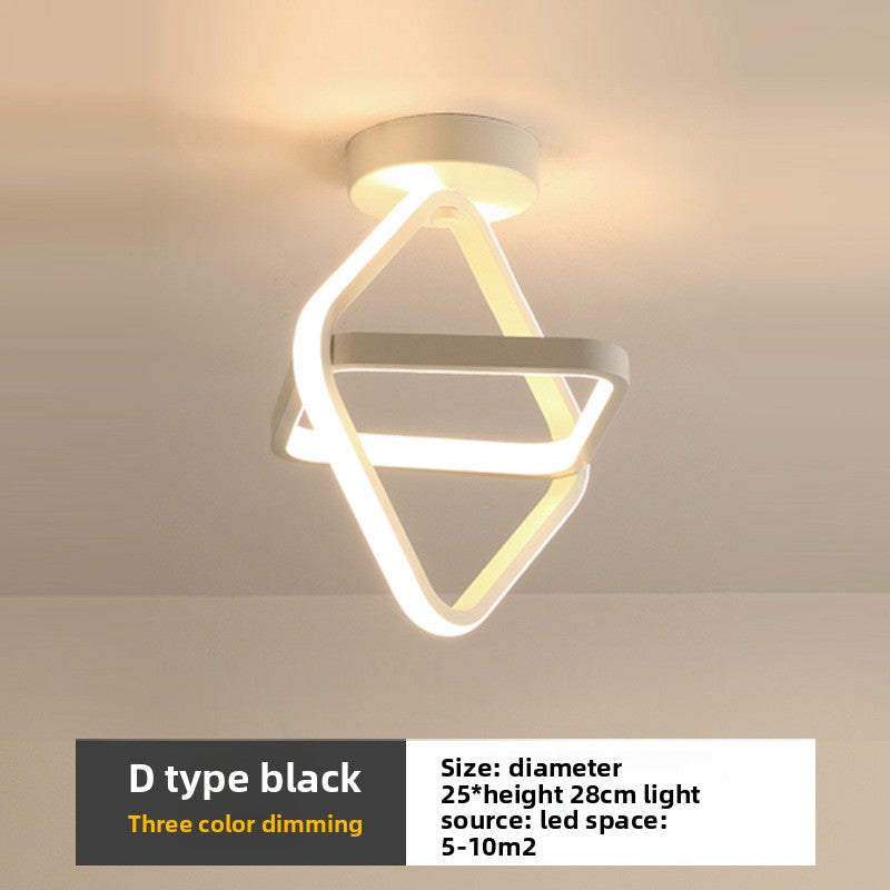 Ceiling light fixture with geometric design on a neutral background