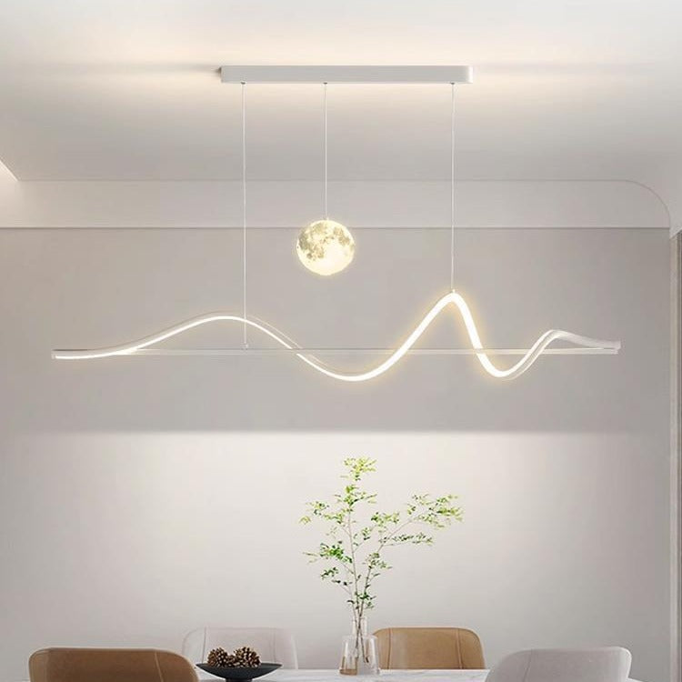 Modern LED pendant light fixture in a minimalistic interior setting.