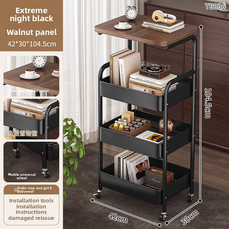 Multifunctional trolley with wooden top and black base, featuring books and decorative items.