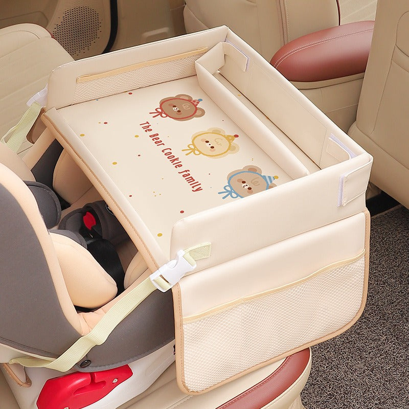 Baby crib with cartoon design attached to a car seat in a vehicle.