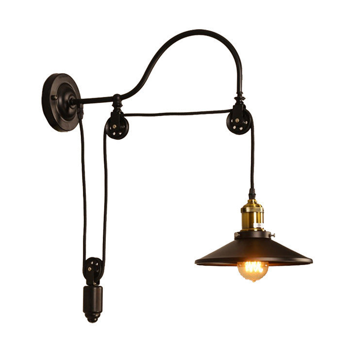 Vintage-style wall lamp with adjustable arm on a white background