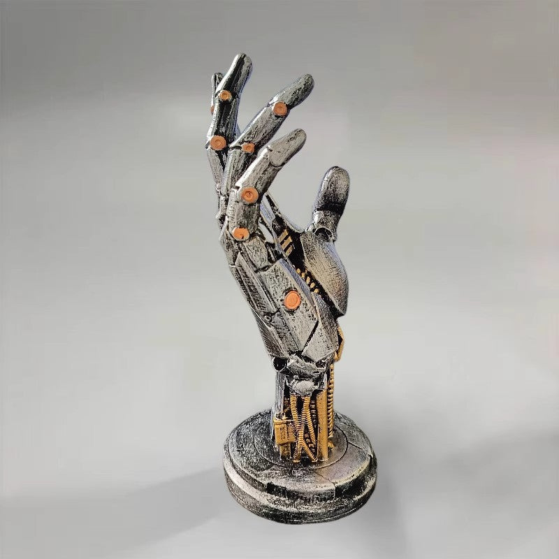 Mechanical hand sculpture on a gray background