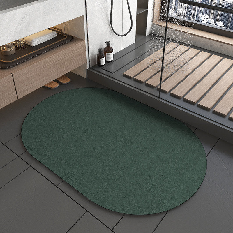 Green round rug on a tiled floor with a bathroom setting in the background.