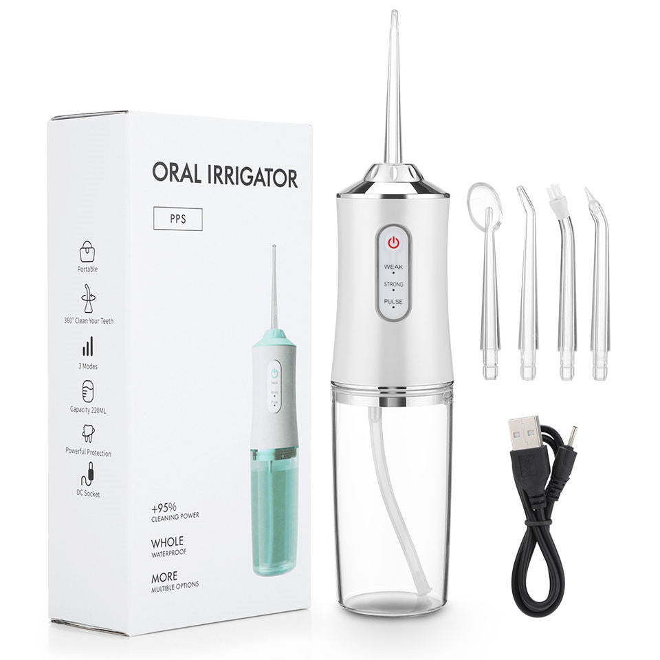 Oral irrigator with packaging, nozzles, and USB cable on a white background