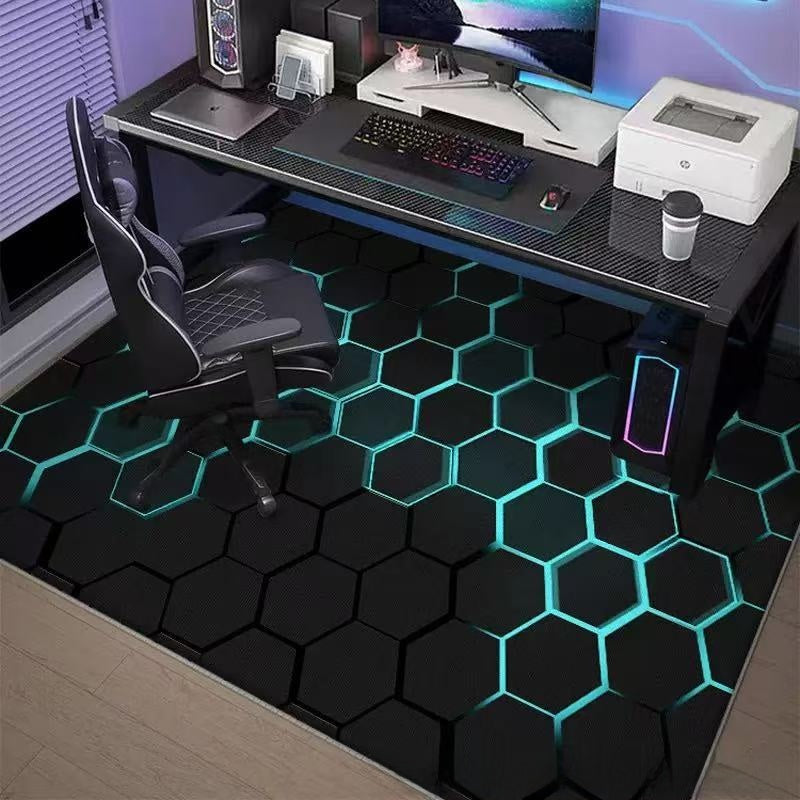 Modern gaming setup with a desk, chair, and computer equipment on a hexagonal patterned floor.