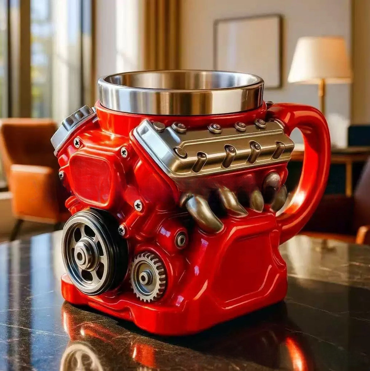 Red engine-shaped mug on a reflective surface with a blurred indoor background