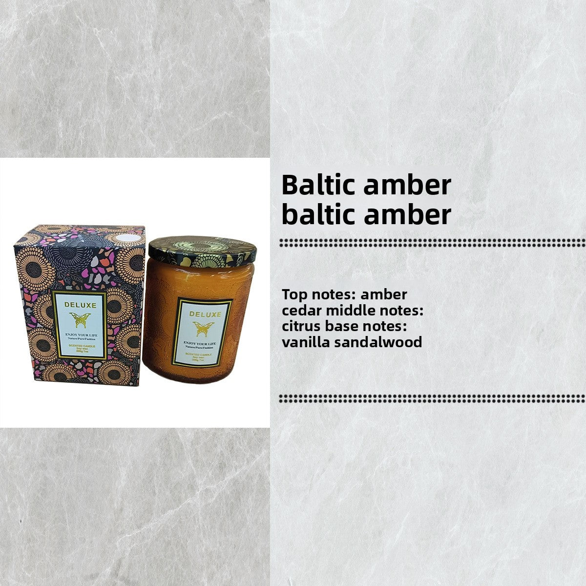 Candle with packaging labeled 'Baltic amber' on a textured gray background