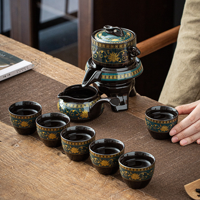 Ceramic tea set with teapot and cups on a wooden table