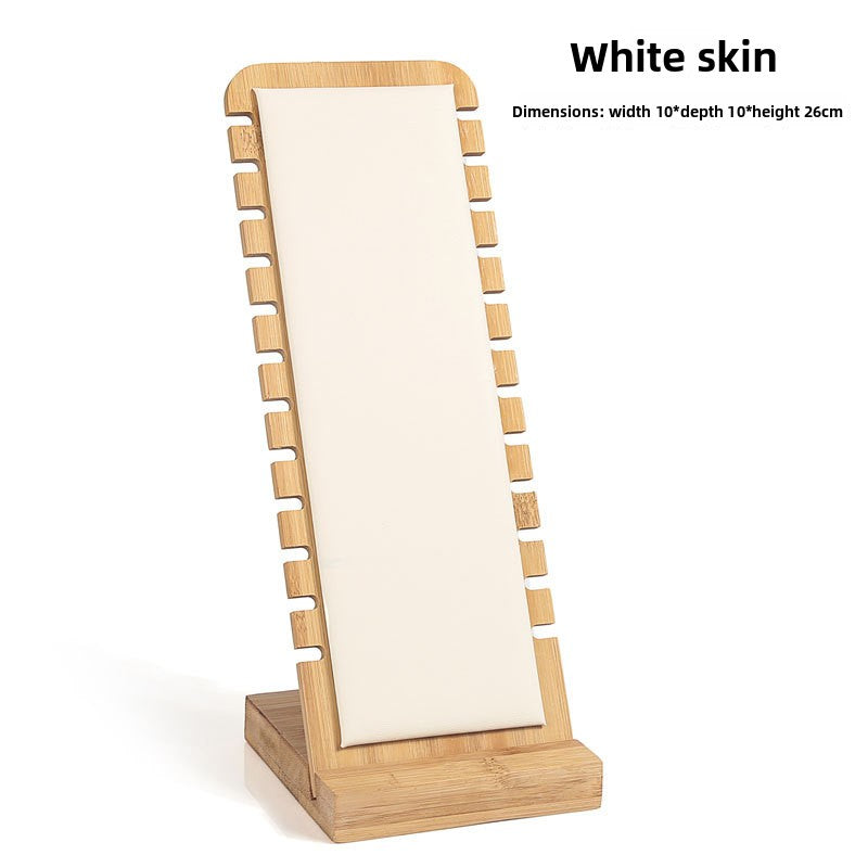 Wooden standing mirror with white surface on a white background