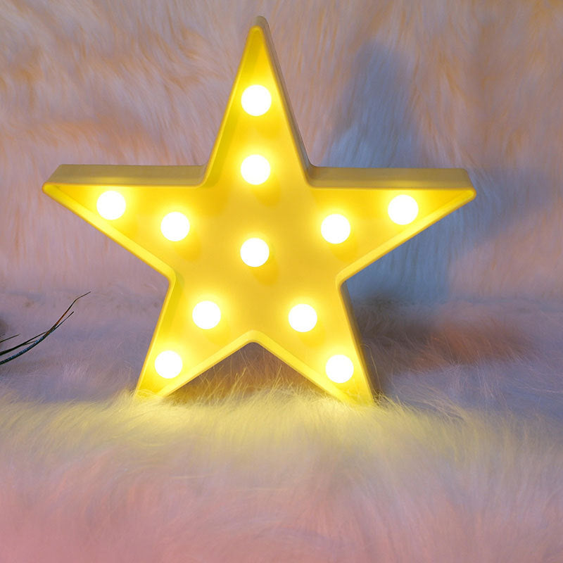 Yellow star-shaped light on a soft, textured background