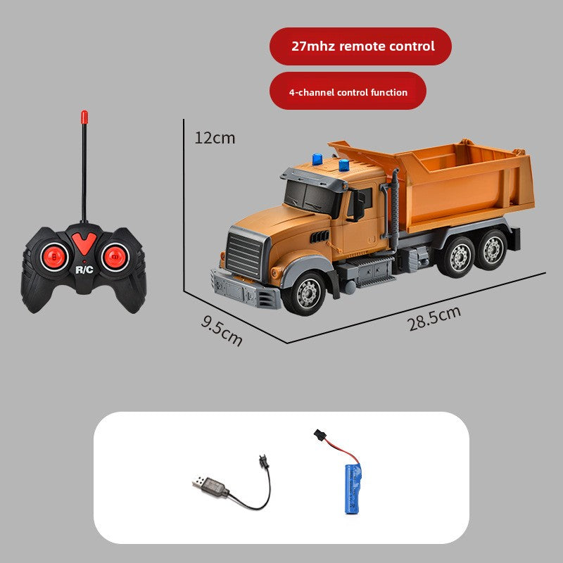 Toy dump truck with remote control, battery, and charging cable on a gray background