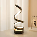 Modern spiral table lamp on a white surface with a light background