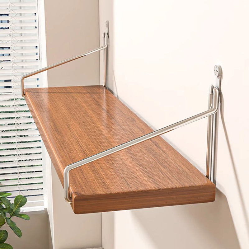Wooden wall-mounted shelf with metal brackets against a neutral wall.