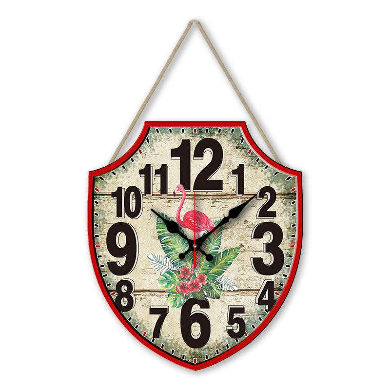 Decorative wall clock with flamingo design on a white background