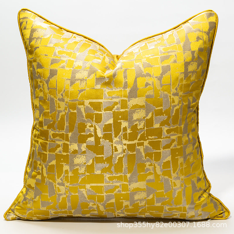 Yellow patterned pillow on a white background